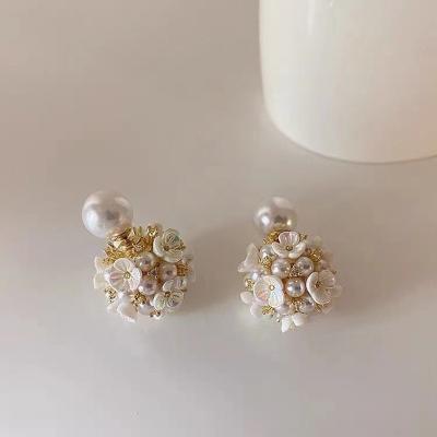 China FASHIONABLE Celebrity Beautiful Female Retro Flower Soft Heavy Industry Exquisite Pearl Spur Earrings for sale