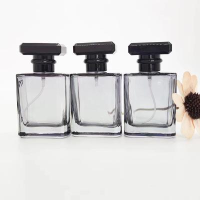 China 50ml Square Gray Color Glass Perfume Bottle Flat Shoulder Cosmetic Set With Black Crown Spray Refillable Bottle for sale