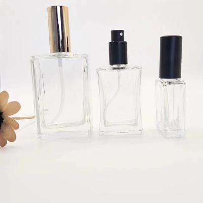 China Wholesale 30ml 50ml 100ml Cosmetic Square Perfume Bottle Spray Glass Refillable Portable Perfume Bottle with Cover for Women and Men for sale