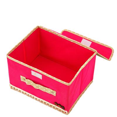 China Hot Selling Amazon Minimalist Mini Foldable Portable Bow Tie Household Snack Miscellaneous Box Non-woven Storage Box for sale