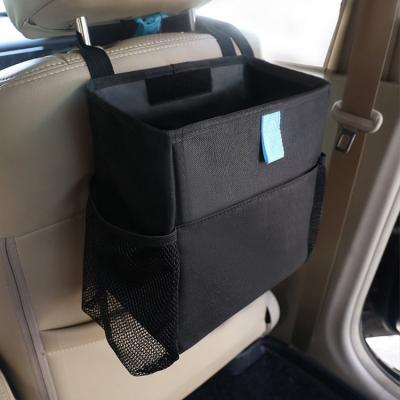 China Car Garbage Bag Back Seat Car Organizer Waterproof Hanging Trash Box With Side Pockets for sale