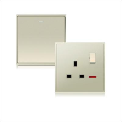 China ELECTRICAL FRAME 250V 10A 1 WAY BAND 1 SWITCH AND SOCKET, GOLD COLOR for sale