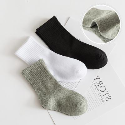 China New student QUICK DRY pure white cotton in the tube children's socks solid color men's and women's casual baby socks socks wholesale for sale