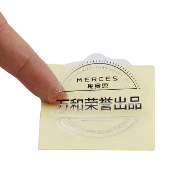 China Customized transparent self-adhesive hot stamping hot stamping silver cosmetic label sticker brand name bottle logo waterproof sticker for sale