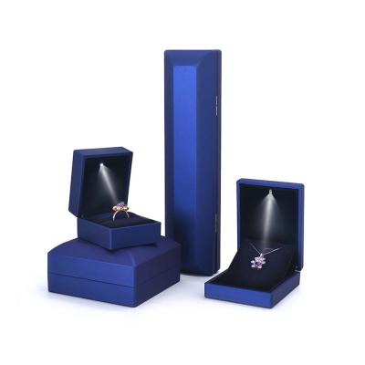 China Luxury High Quality Blue Led Jewelry Box Ring Pendant Box Luxury Suede Light Jewelry Box Packaging Necklace Wedding Gift for sale