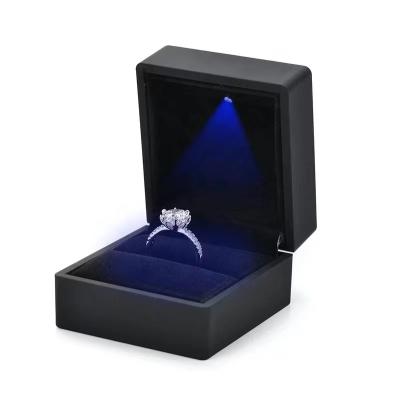 China Factory Direct Supply Luxury Jewelry Boxes Latest Led Logo Black Engagement Ring Box Custom Made With Led Light for sale