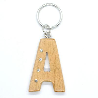 China Custom Made Original English Name Personalized By OEM Laser Wood Handmade Fashionable Cut A Wooden Diamond Key Chain for sale