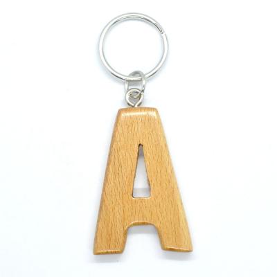 China Letter wooden initial personality A key chain, wholesale customization key tag diy engraving natural wood rack for sale