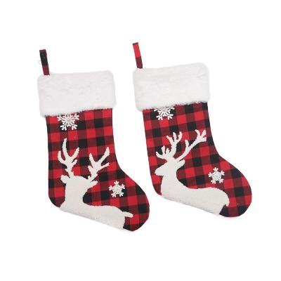 China Polyester Personalized Christmas Season Snowflake Elk Plush Plaid White Edges Christmas Furry Stockings for sale