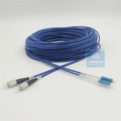 China LSZH FTTX FC LC Duplex Armored Fiber Optic Patch Cord 50m 3.3mm Blue for sale