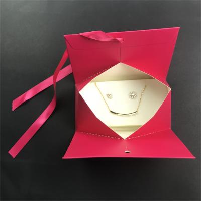 China Recycled materials wholesale joyeria de para de cajas logo gift jewelry paper box bag mini handle custom foldable packing ribbon bag for sale