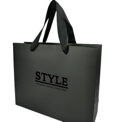 China Recycled Materials Logo Jewelry Packaging Kraft Shopping Custom Printed Paper Bag With Ribbon Handles for sale