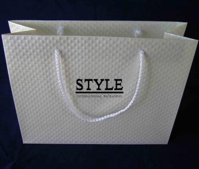 China Hotstamping handmade ivory white logo in black special paper gift bags with rope handles custom handmade shopping paper bags for sale