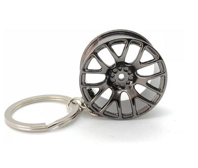 China Promotion Gift Factory Wholesale Custom Auto Parts Rearview Mirror Zinc Alloy Steering Wheel Ornaments 3D Metal Tire Key Chain for sale