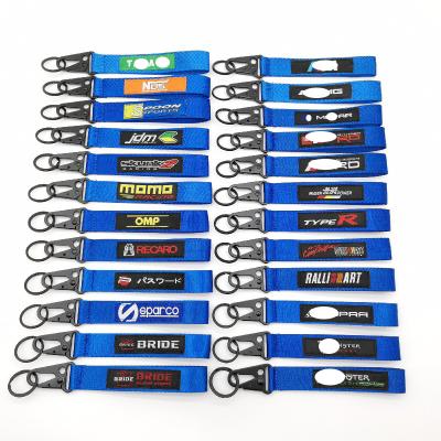 China Custom Wholesale Nylon Woven Car Accessories Logo Keyring Buckle Decoration Gift Refitting Nylon Blue Auto Brand Key Chain Label Emblem for sale