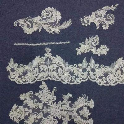 China Viable Wholesale Cheap Recommended Net Lace Fabric For Wedding Bridal Sequin Embroidery Lace Fabrics for sale