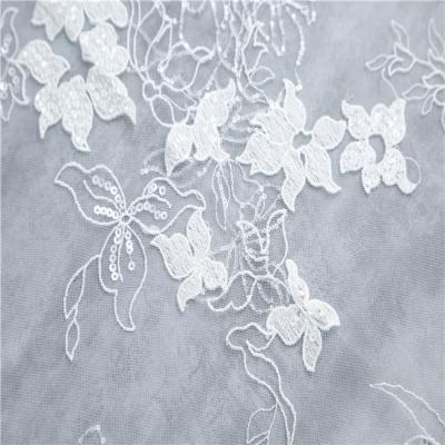 China Viable Most Popular 100% Polyester Embroidered Tulle Lace Up Fabric Wedding Lace Dress for sale