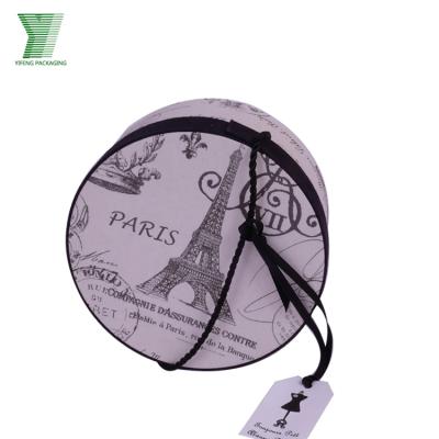 China Recyclable Eiffel Tower Custom Printing Round Cardboard Packing Gift Boxes With Black Hand Taps for sale