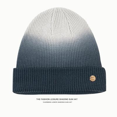 China ODM Fashion Trendsetters COMMON Stripe Gradient Dye Knotting Knitting Cap In Autumn And Winter for sale