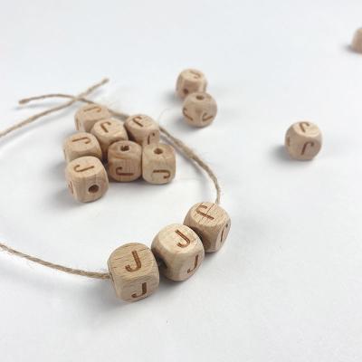 China DIY Wooden Dies 12mm Laser Engraved Color Beech Square Alphabet Accessory Custom Wood Letter Beads With Hole for sale