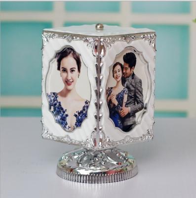 China Morden And Simple 5 Inch Creative Rotating Cogs Music Box PVC Photo Frame for sale