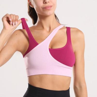 China Latest Viable Ladies Workout Waist Resistance 3 Strap Sports Bra Back 2 Tone Colors Nylon Cross Back Sports Yoga Fitness Sports Bra for sale