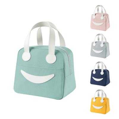 China Casual Outstanding Quality Different Colors Smile Face Reusable Portable Lunch Bag for sale