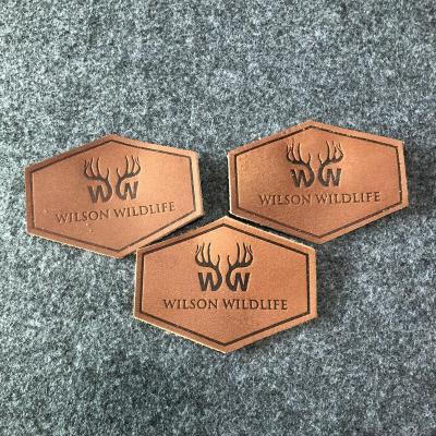 China Viable custom genuine fake embossed leather label for handbags label leather tags leather label for hat for sale