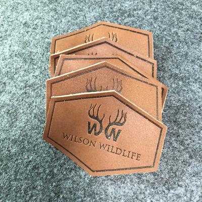 China Viable custom embossed leather brand metal logo label tag for clothing handbags patch leather label for sale