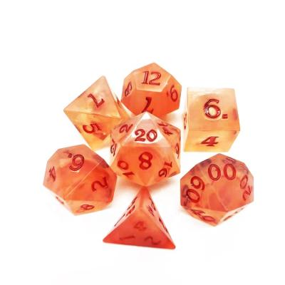 China DND /RPG Games Wholesale Clear Edges Plastic Dice With Red Polyhedral Glitter DND Dice Set for sale