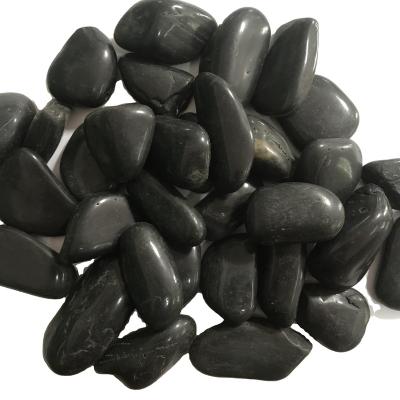 China Home Decorative Stone Pebbles High Polished Natural Black Pebbles Stones For Garden for sale