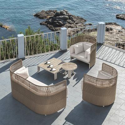 China Clean UK style 4 PIECE rattan garden patio cheap furniture coffee table sectional outdoor sofa set for sale