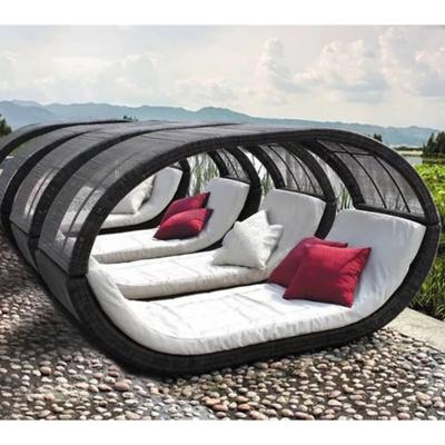 China Clean Color Folding Folding Rattan Sun Day Bed Outdoor Wicker Beach Lounger Chairs Outdoor Rattan With Orange Pillows for sale