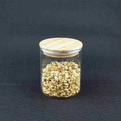 China Round Glass Freshness Preservation Brocilate Clear Storage Jar With Bamboo Lid for sale