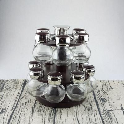 China 14pcs Glass Spice Stocked Jars Rack Set With Plastic Double Layers Rotating Rack for sale