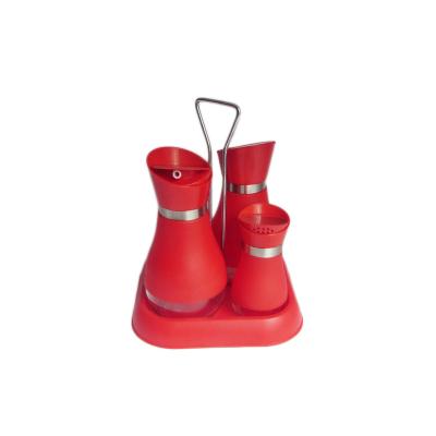 China Freshness Preservation Glass Spice And Oil Bottles With Screw Lid And Red Plastic Holder for sale