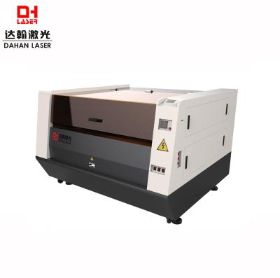 China 150w laser cutter factory price co2 laser wood and metal cutting and engraving machine for sale