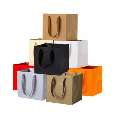 China Black Recyclable Cardboard Paper Bag Custom Printed Logo Clothing Packaging Gift Carrier Bag Shopping Paper Bags Luxury for sale