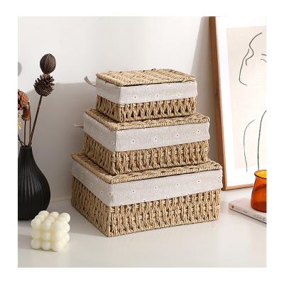 China Sustainable handmade rattan storage basket set shelf weaving decorative home storage box basket and fabric art for sale