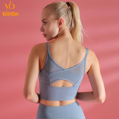 China Sale Breathable Full Body High Stretch Strap Yoga Top Stylish Cross Gym Running Racerback Woman Sports Bra Quick Dry Simple Dyed Spandex/Nylon for sale