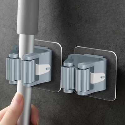 China Wall Mounted Hanger Holder Brush Broom Organizer Broom Pipe Hooks Storage 4PCS Suction Rack Home Viable High Quality Bathroom for sale