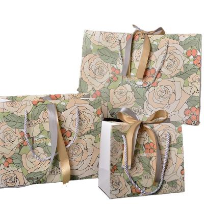 China Recyclable Red Champagne Rose Paper Bag Luxury Jewelry Shopping Candy Gift Wrapping Bags For Presents With Rose Gold Ribbon Handle Bowknot for sale