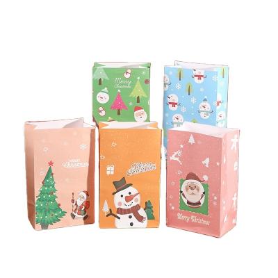 China Recyclable Santa Pattern Colored Cartoon Christmas Gift Bag Recyclable Kraft Paper Christmas Gift Bag Custom Printing Packaging Bags Without Handles for sale