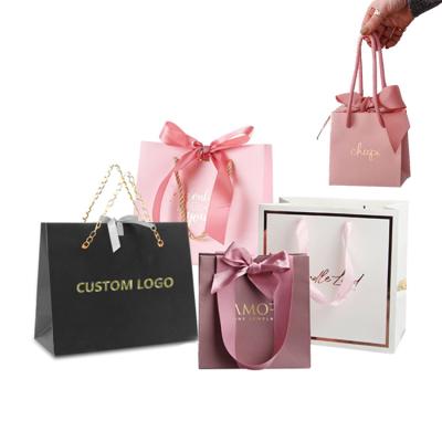 China JuYi Recyclable Hot Sales High Quality Logo Hair Extension Packaging Clothing Gold Foil Jewelry Skin Care Customized Cosmetic Paper Bags for sale