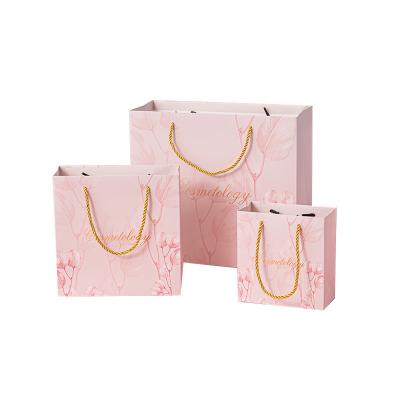 China JuYi Matt Finish Jewelry Skin Recyclable Custom Retail Bulk Care Gift Bag Pink Clothing Shoes Paper Shopping Bags For Woman for sale