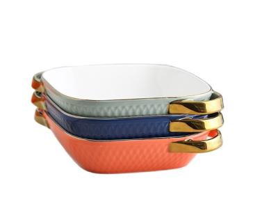 China New Arrival Viable Ceramic Binaural Bowl Solid Color With Gold Trim Handle Embossed Pattern Bakeware Tray For Baked Food Use Oven Safe for sale