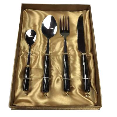 China Sustainable High Quality Stainless Steel Silverware Flatware Set Gold Twist Patterned Black Ceramic Handle With Packaging Gift Box for sale