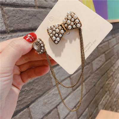 China New Arrial Luxury Crown Bowknot Pearl Flower Number 5 Tassel Brooches Pins for sale