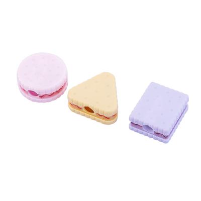 China Promotional Eco-friendly Material Wholesale Lead Macaron Cookie Shape Plastic Cartoon Kids Gift Colored Cute Pencil Sharpeners for sale