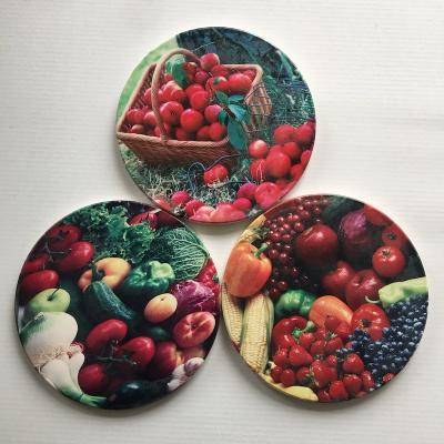 China Minimalist Round Mat 15cm Round Fruit Cork Paste Party Ceramic Bottom Tripod Water Cup Mat UV Printing Customization for sale